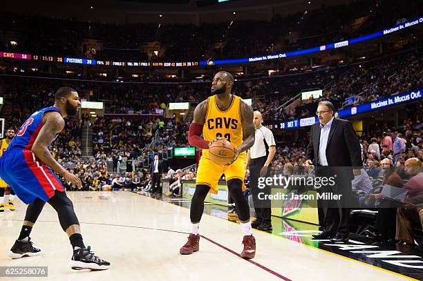 Marcus Morris of the Detroit Pistons guards LeBron James of the Cleveland Cavaliers during the second half at Quicken Loans Arena on November 18,...