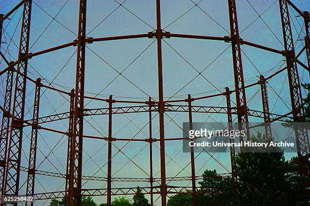 Gas holder. A large container in which natural gas or town gas is stored near atmospheric pressure at ambient temperatures. London. Dated 21st...