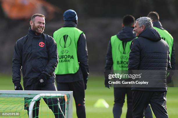 Wayne Rooney and Jose Mourinho manager of Manchester United smile during a Manchester United training session on the eve of their UEFA Europa League...