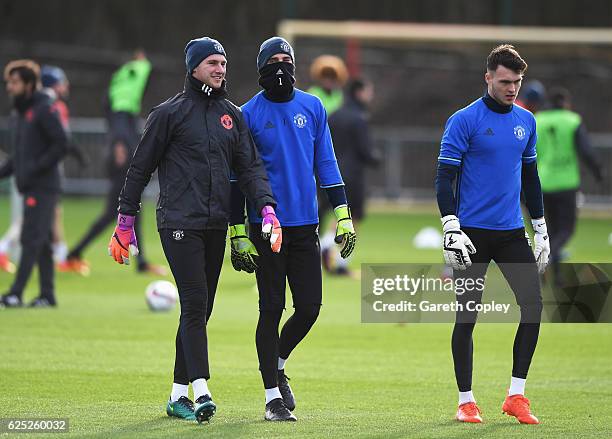 Goalkeeper Sam Johnstone, David De Gea and Kieran O'Hara look on during a Manchester United training session on the eve of their UEFA Europa League...