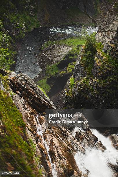waterfall in mountains, norway - voringsfossen stock-fotos und bilder