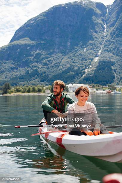 couple on canoe - fjord stock pictures, royalty-free photos & images