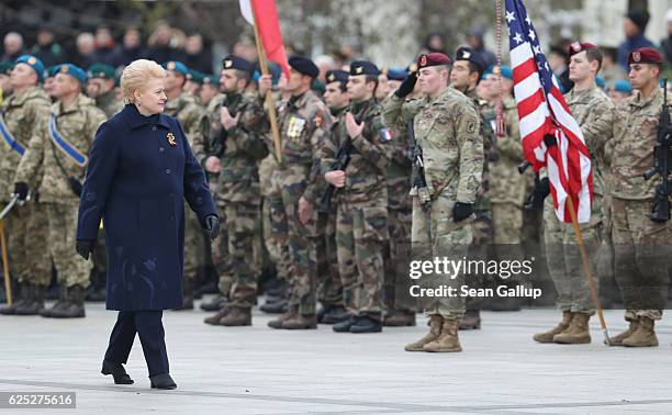 Lithuanian President Dalia Grybauskaite walks past soldiers of the U.S. 173rd Airborne Brigade participating in a gathering and parade in the city...