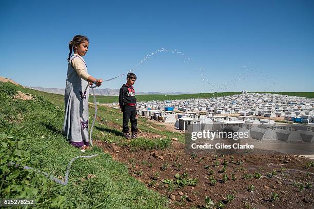 Above the Sharya IDP camp that is now a safe-haven for some 20,000 internally displaced people, most of whom left their homes as ISIS advanced on...