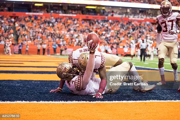 Tarvarus McFadden and Ryan Green of the Florida State Seminoles celebrate an interception during the game against the Syracuse Orange on November 19,...