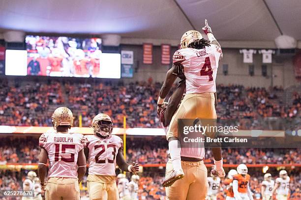 Dalvin Cook of the Florida State Seminoles celebrates a touchdown run during the game against the Syracuse Orange on November 19, 2016 at The Carrier...