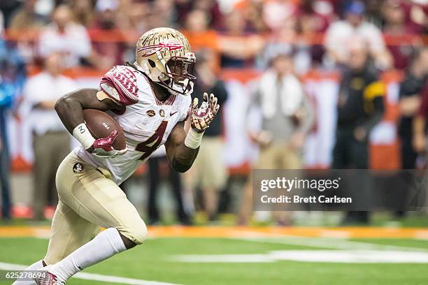 Dalvin Cook of the Florida State Seminoles carries the ball during the game against the Syracuse Orange on November 19, 2016 at The Carrier Dome in...