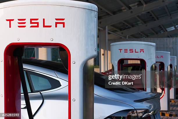 tesla supercharger parking - tesla model s stock pictures, royalty-free photos & images