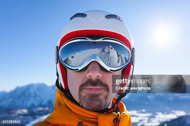 man with skiing goggles and reflections - ski goggles stock pictures, royalty-free photos & images