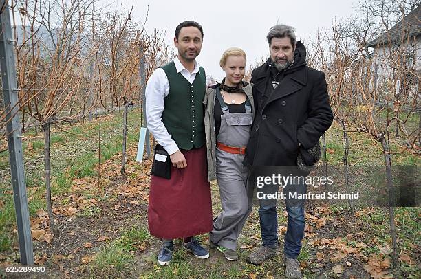 Deniz Cooper, Katharina Strasser and director Sascha Bigler pose during the 'Herrgott fuer Anfaenger' set visit in Vienna at Heuriger Sirbu on...
