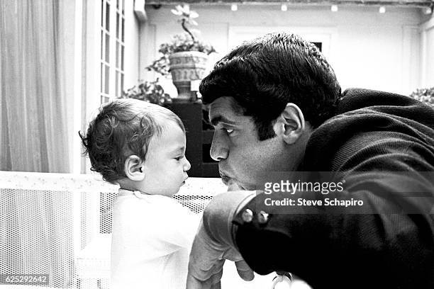 American actor Elliott Gould plays with his son, Jason, in their home, Beverly Hills, California, 1967.