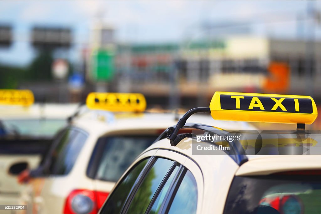 Taxi signs - cars waiting for passenger