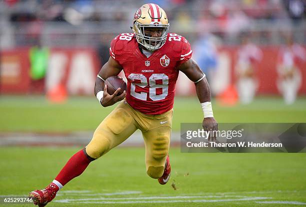 Carlos Hyde of the San Francisco 49ers carries the ball against the New England Patriots in the first quarter of their NFL football game at Levi's...