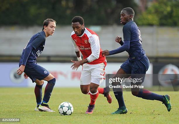 Kaylen Hinds of Arsenal takes on Boubakary Soumare and Theo Epailly of PSG during the UEFA Youth League match between Arsenal and Paris Saint Germain...