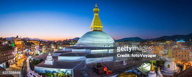 boudhanath stupa iconic buddhist temple illuminated at sunset kathmandu nepal - nepal stock pictures, royalty-free photos & images