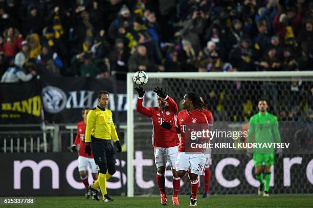 Bayern Munich's players react after Rostov's forward Dmitri Poloz scored his team's second goal from a penalty kick during the UEFA Champions League...