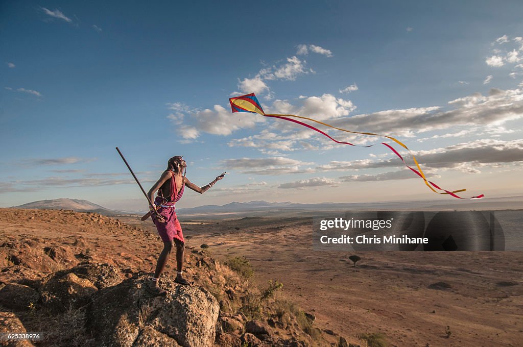 Maasia Warrior Flying Kite and Having Fun with Scenic View