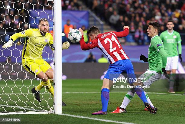Kevin Gameiro of Atletico Madrid celebrates scoring his sides first goal during the UEFA Champions League Group D match between Club Atletico de...