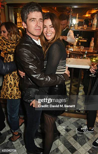 Noel Gallagher and Sara Macdonald attend the adidas Originals by Rita Ora dinner at The Ivy Chelsea Garden on November 23, 2016 in London, England.