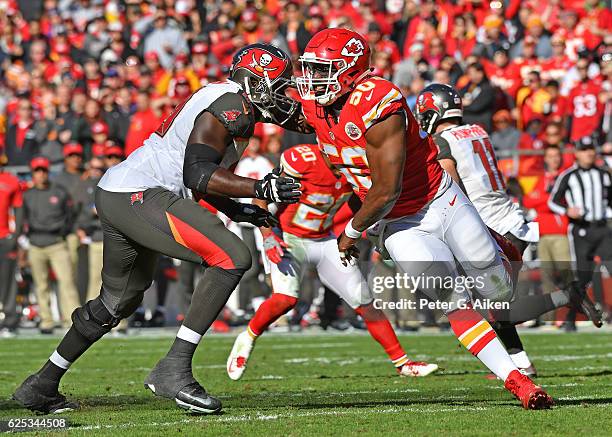 Linebacker Justin Houston of the Kansas City Chiefs rushes against Offensive tackle Demar Dotson of the Tampa Bay Buccaneers during the first half on...