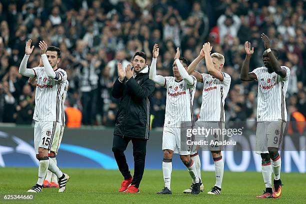 Players of Besiktas celebrate after the UEFA Champions League Group B football match between Besiktas and Benfica at Vodafone Arena in Istanbul,...