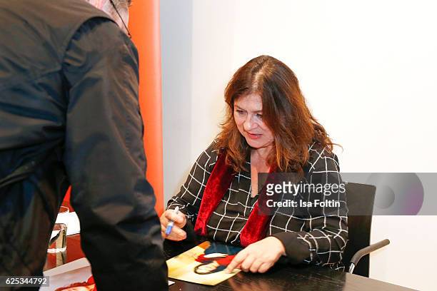 German actress Eva Mattes signs autographs after the reading of Elena Ferrantes novel 'Meine geniale Freundin' at Literaturhaus on November 22, 2016...