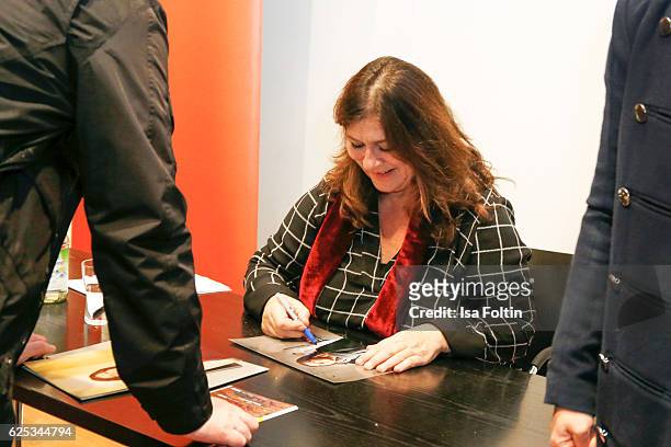 German actress Eva Mattes signs autographs after the reading of Elena Ferrantes novel 'Meine geniale Freundin' at Literaturhaus on November 22, 2016...