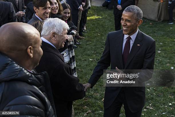 President Barack Obama greets guests after pardoning Tater, his last National Thanksgiving Turkey as President, during a ceremony in the Rose Garden...