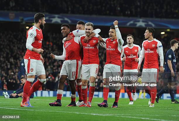 Olivier Giroud, Alex Iwobi, Aaron Ramsey and Alexis Sanchez celebrate the 2nd Arsenal goal during the UEFA Champions League match between Arsenal FC...