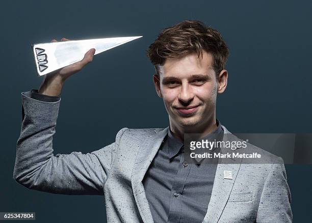 Flume poses for a portrait with an ARIA after winning ARIA awards for Best Independent Release, Best Pop Release, Best Dance Release, Best Male...