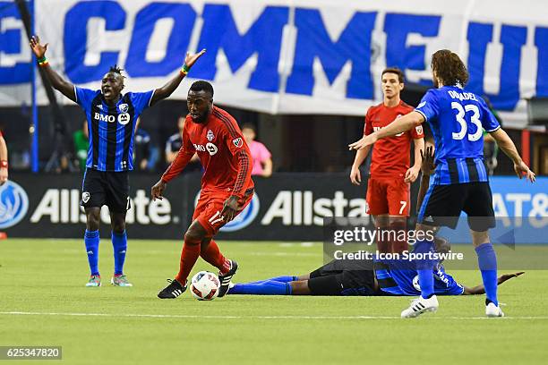 Toronto FC forward Jozy Altidore running away with the ball after getting into contact with Impact defender Hassoun Camara during the Toronto FC...