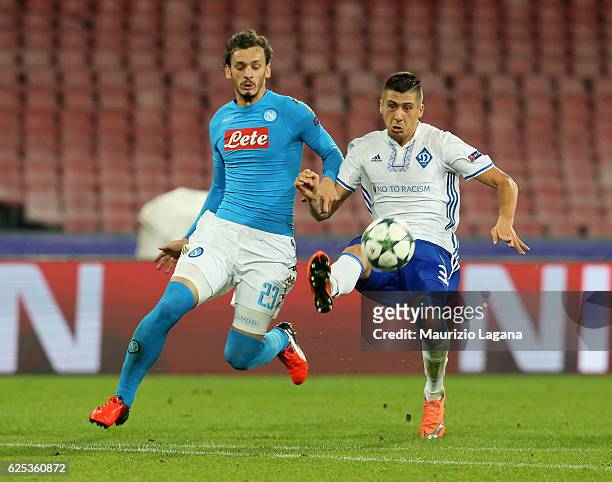 Manolo Gabbiadini of Napoli competes for the ball with Yevhen Khacheridi of Dynamo Kyiv during the UEFA Champions League match between SSC Napoli and...