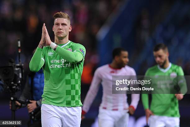 Jordy De Wijs of PSV Eindhoven applauds his team's fans at the end of the UEFA Champions League match between Club Atletico de Madrid and PSV...