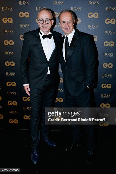 Director Finance & HR & Administration at Hugo Boss, Volker Herre and CEO of Condenast France Xavier Romatet attend the GQ Men of the Year Awards...