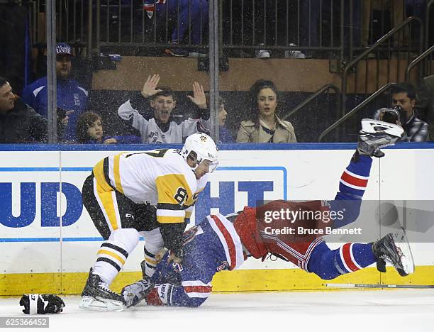 Sidney Crosby of the Pittsburgh Penguins takes a first period roughing penalty against Ryan McDonagh of the New York Rangers at Madison Square Garden...