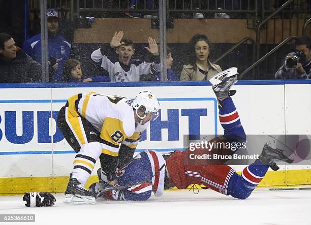 Sidney Crosby of the Pittsburgh Penguins takes a first period roughing penalty against Ryan McDonagh of the New York Rangers at Madison Square Garden...