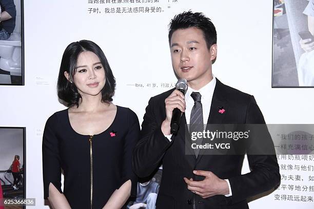 Actor David Tong and his wife Guan Yue attend a photography show as he is named Goodwill Ambassador for UN Women's Agency at 798 Art Zone on November...