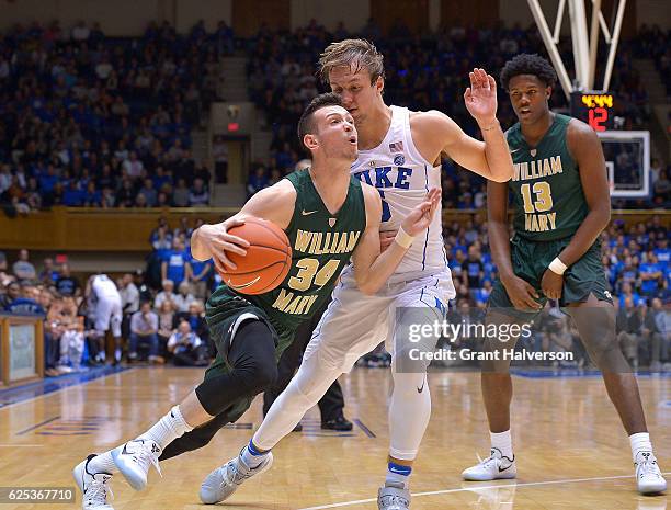 Luke Kennard of the Duke Blue Devils fouls David Cohn of the William & Mary Tribe on a drive to the basket during the game at Cameron Indoor Stadium...