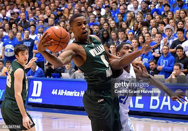 Daniel Dixon of the William & Mary Tribe battles Amile Jefferson of the Duke Blue Devils for a rebound during the game at Cameron Indoor Stadium on...