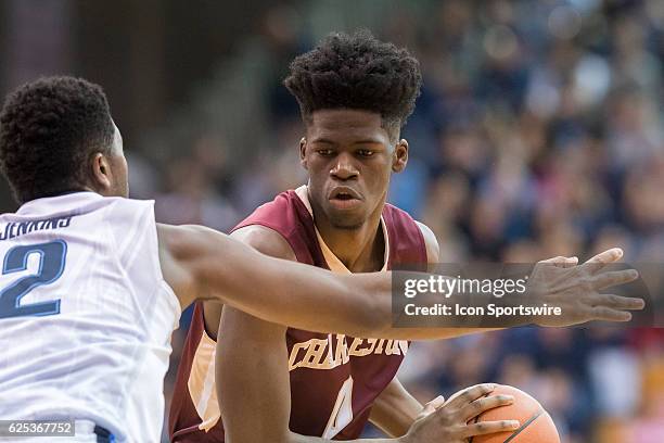 Charleston Cougars guard John Eck looks to get past Villanova Wildcats forward Kris Jenkins During the game between the Charleston Cougars and the...