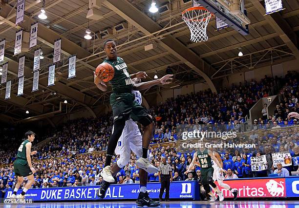 Daniel Dixon of the William & Mary Tribe battles Amile Jefferson of the Duke Blue Devils for a rebound during the game at Cameron Indoor Stadium on...