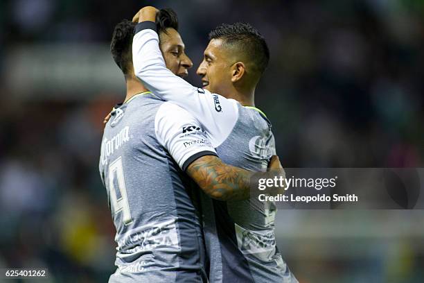 German Cano of Leon celebrates with Elias Hernandezafter scoring his team's third goal during the quarter finals first leg match between Leon and...