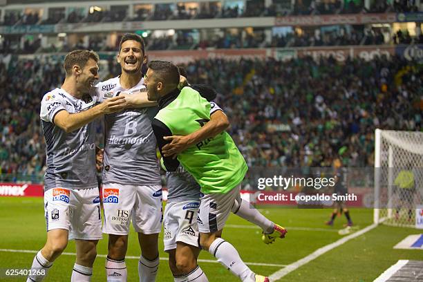 German Cano of Leon celebrates after scoring his team's third goal with with Mauro Boselli, Guillermo Burdisso and Maximiliano Moralez during the...