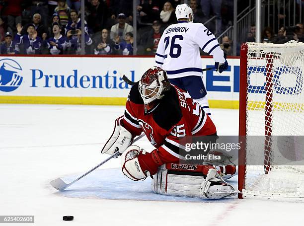 Cory Schneider of the New Jersey Devils stops a shot by Nikita Soshnikov during a shootout to win the game on November 23, 2016 at Prudential Center...