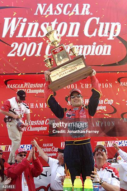 Jeff Gordon celebrates winning the championship at the NASCAR Winston Cup NAPA 500 at the Atlanta Motor Speedway in Hampton, Georgia. Digital Image....