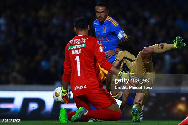 Matias Britos of Pumas fights for the ball with with Nahuel Guzman of Tigres during the quarter finals first leg match between Pumas UNAM and Tigres...