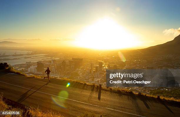 shadow running. - cape town cityscape stock pictures, royalty-free photos & images