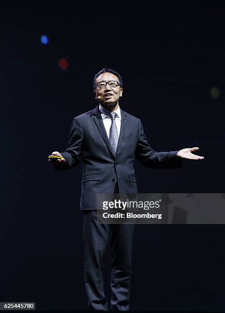 Ken Miyauchi, president and chief executive officer of SoftBank Mobile Corp., speaks during the annual Huawei Global Mobile Broadband Forum in Chiba,...