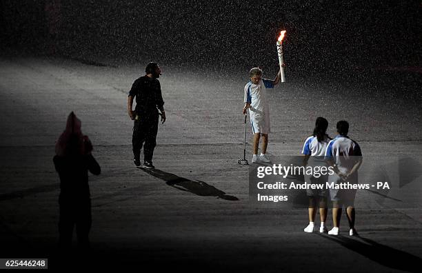 Marcia Malsar carries the Paralympic flame during the opening ceremony of the 2016 Rio Paralympic Games at the Maracana, Brazil.