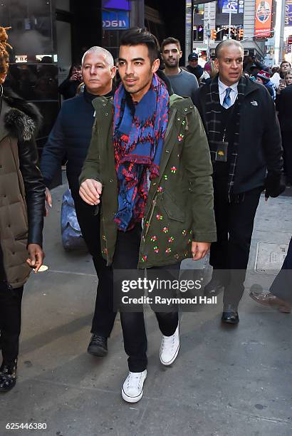 Musician Joe Jonas, of DNCE, leaves the 'Good Morning America' taping at the ABC Times Square Studios on November 23, 2016 in New York City.